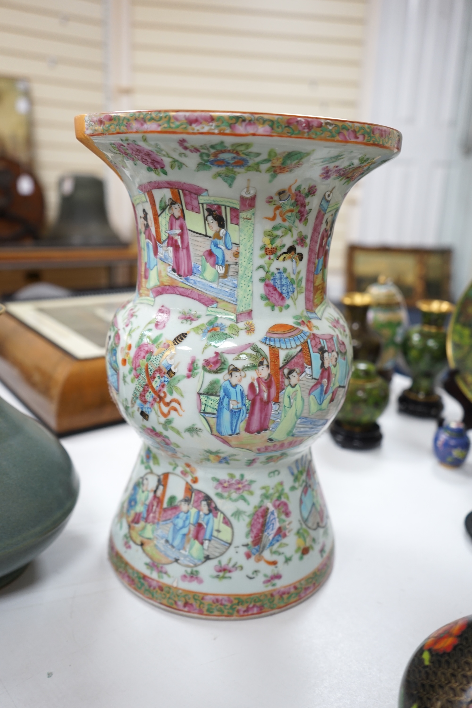 A large 19th century Chinese famille rose vase, a green glazed pear-shaped vase, and a blue and white dragon flask (3). Condition - poor to fair.